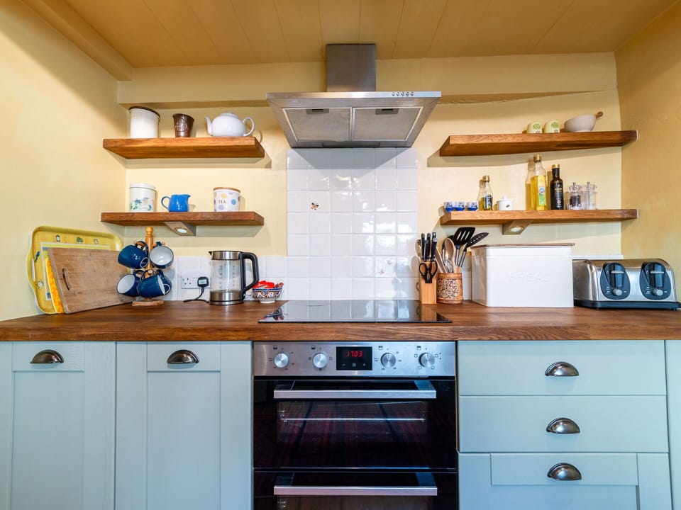 Kitchen, Kitchen Appliance, Countertop, Major Appliance, Cabinetry, Interior Design, Flooring, Wood, Kitchen Stove, Home Appliance