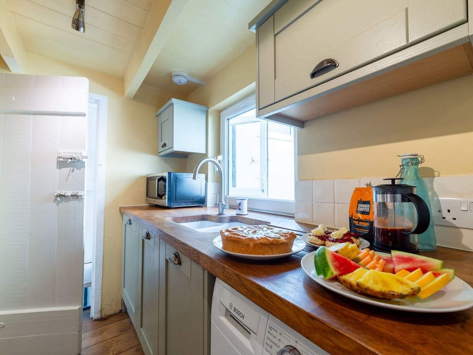 Wood, Flooring, Interior Design, Kitchen Appliance, Major Appliance, Furniture, Floor, Kitchen, Countertop, Cabinetry