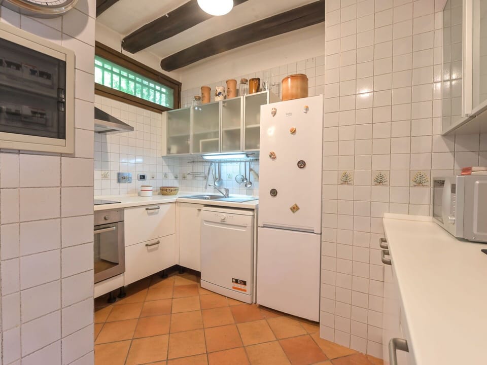 Kitchen, Flooring, Countertop, Interior Design, Ceiling, Kitchen Appliance, Floor, Major Appliance, Cabinetry, Light Fixture
