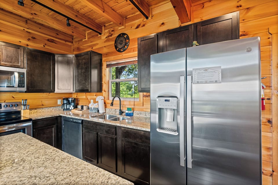 Fully equipped kitchen with granite & stainless steel