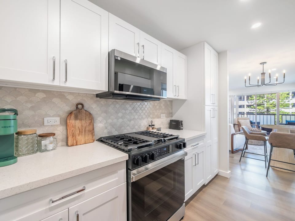 Kitchen - From morning coffee to quick dinners, a thoughtfully finished kitchen supports effortless days between beach sessions.