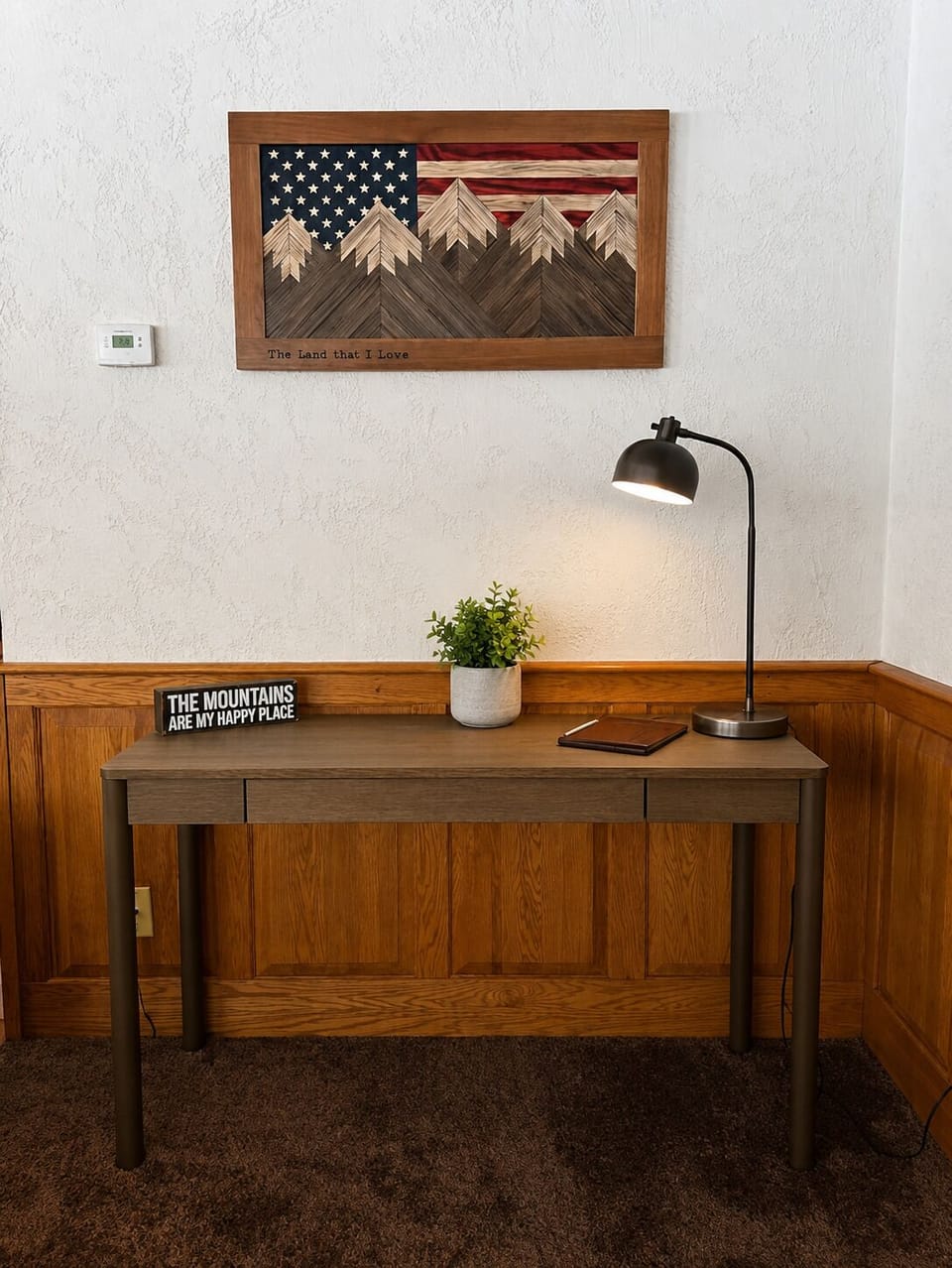 Cozy mountain-inspired workspace with rustic decor and warm lighting