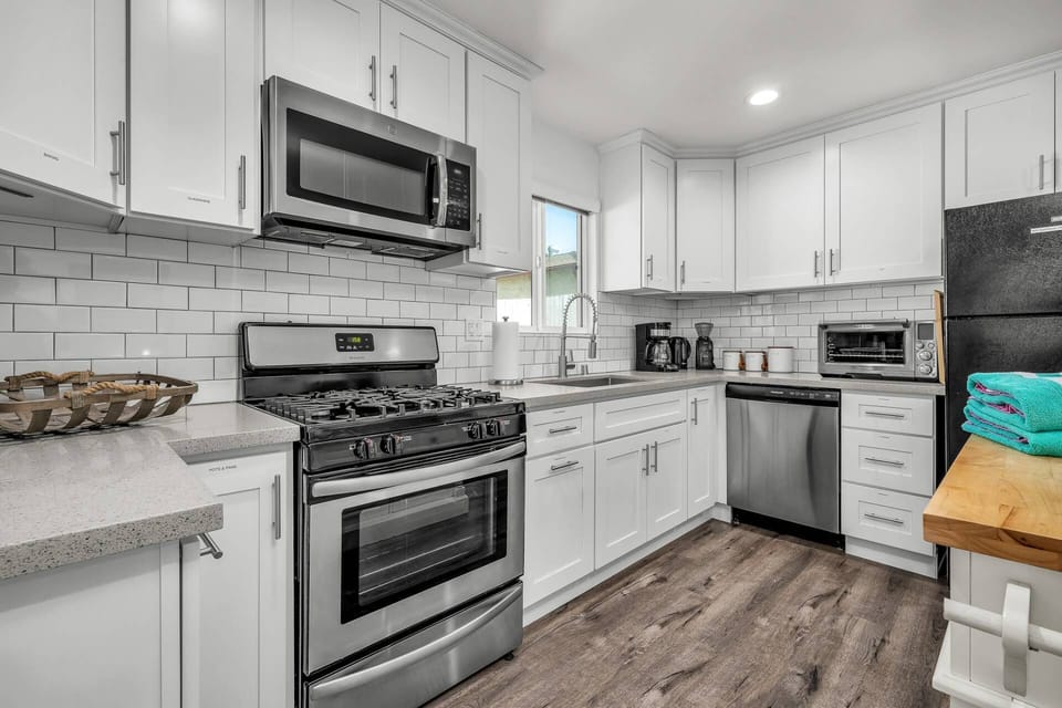 Cook all your favorite meals in our fully equipped modern kitchen. Appliances include dishwasher, refrigerator, oven/stove, and microwave.