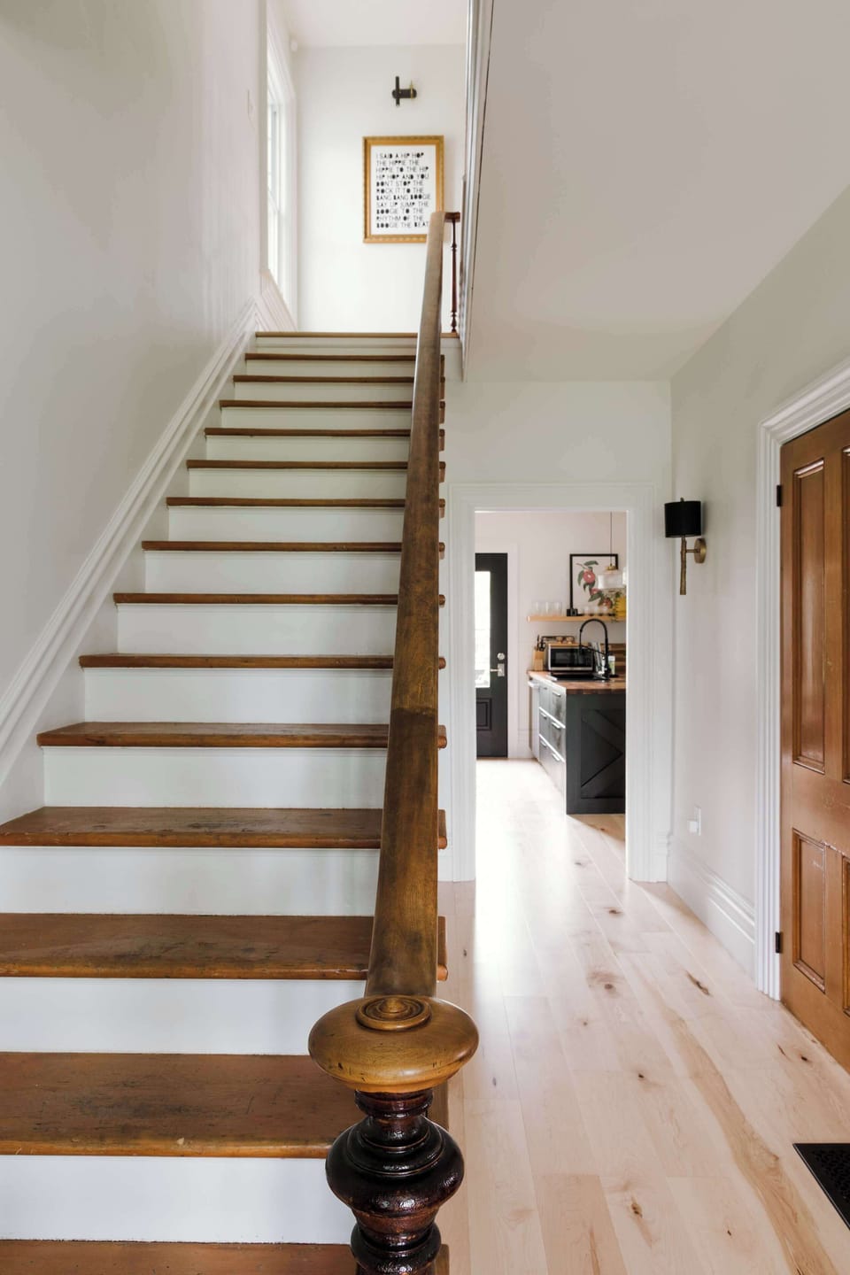 As you enter the kitchen + access to backyard are at the end of the hall. Living room is to the left + bedrooms are upstairs.