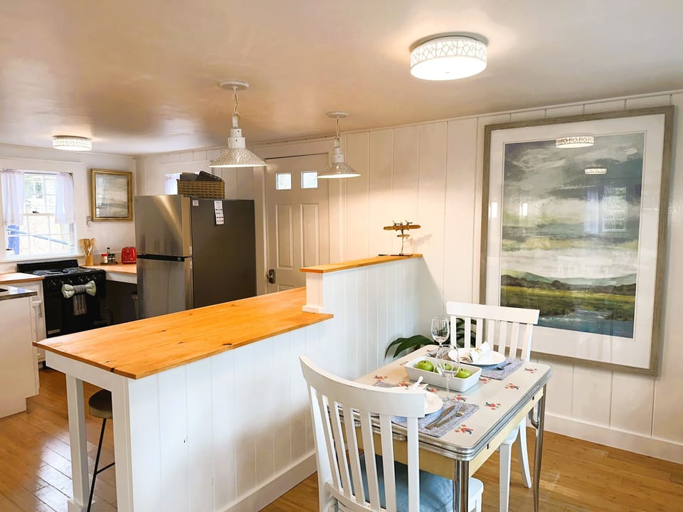 Dining room, breakfast bar, and kitchen