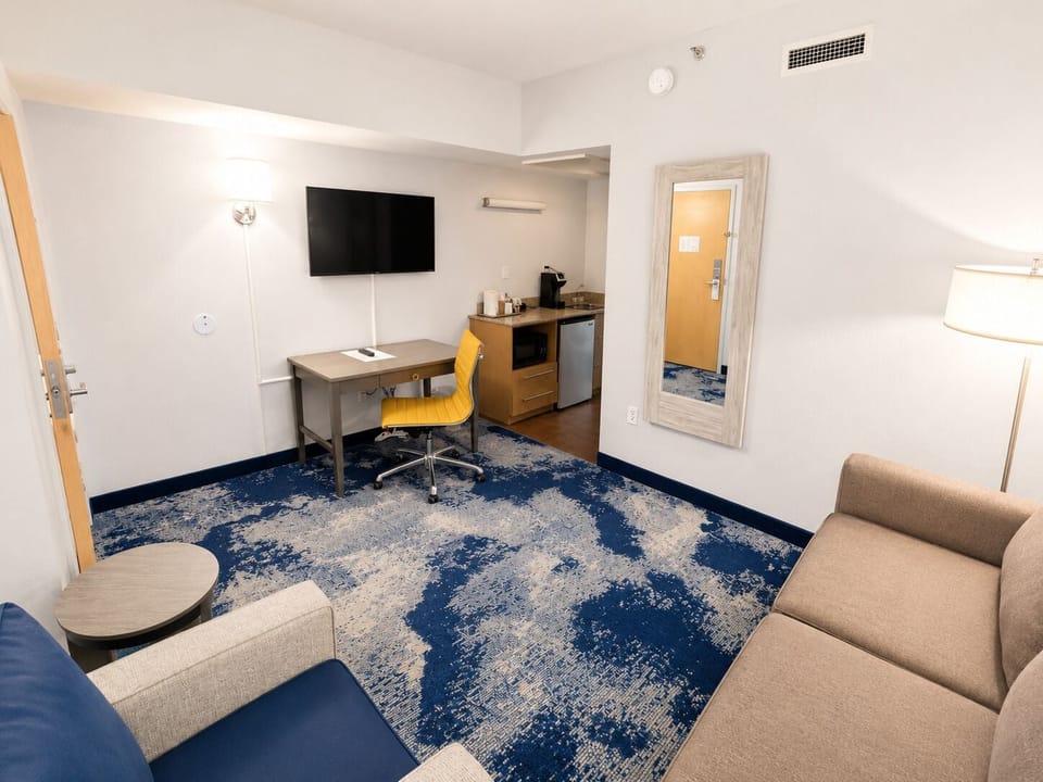 Suite, Multiple Beds (North) | Living area | TV