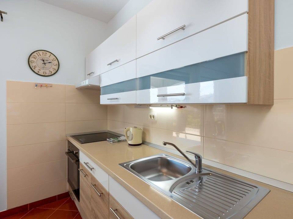 Furniture, Wood, Interior Design, Cabinetry, Kitchen, Flooring, Countertop, Cupboard, Room, Wood Stain