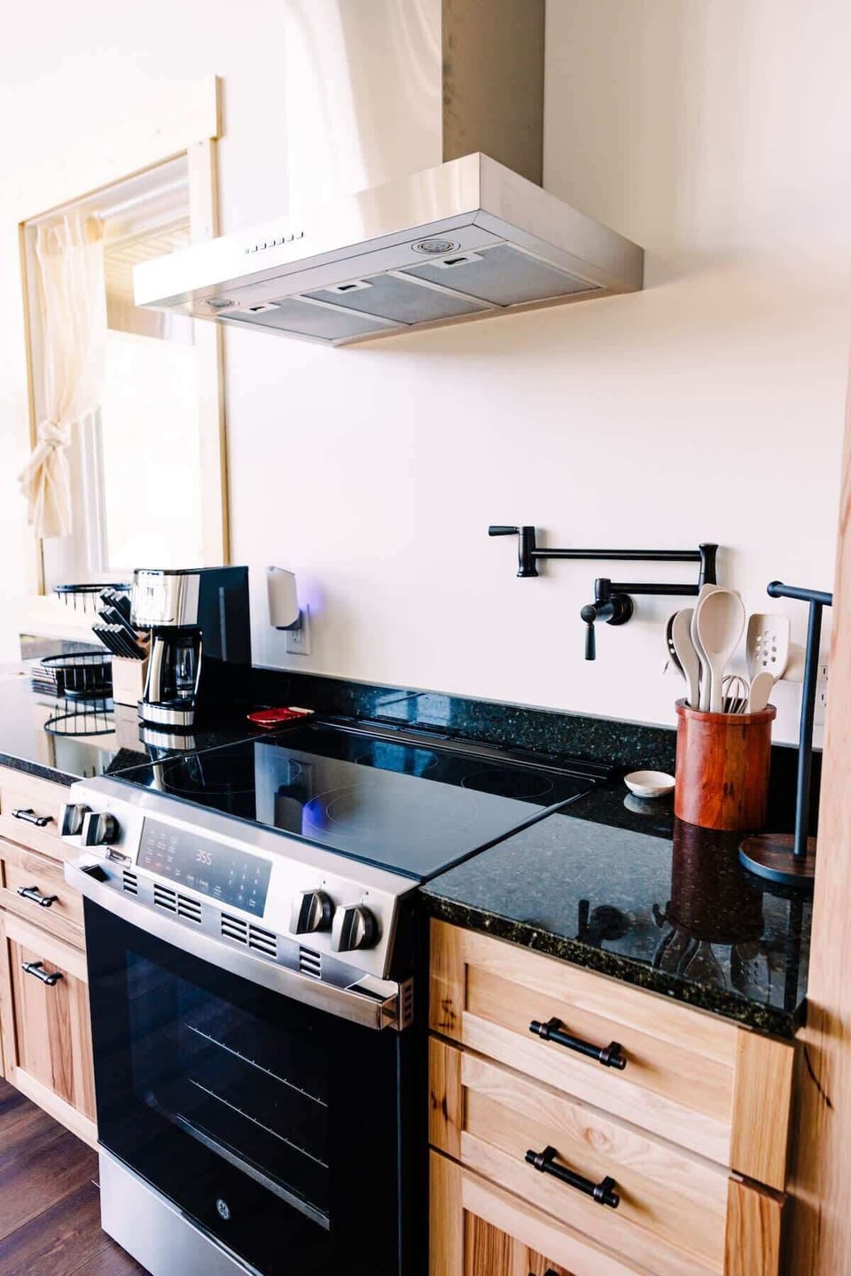 Beautiful glass stop stove with large oven and pot filler faucet