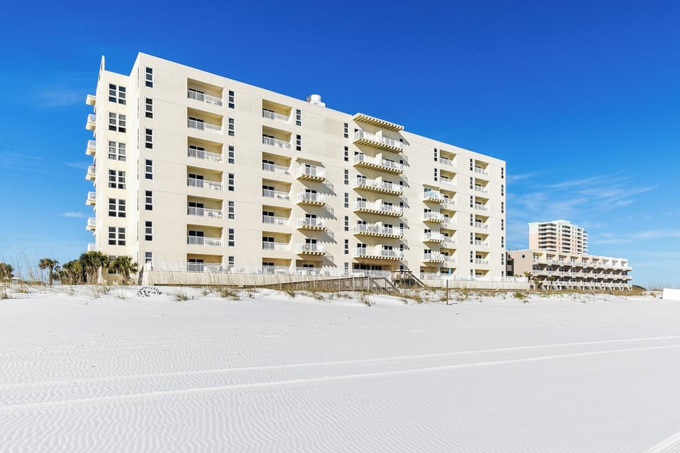 San Souci backside of the building facing the sugar white sand and ocean.