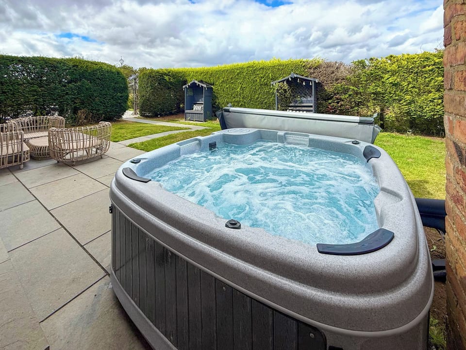 Hot tub on patio | The Old School, Ganton, near Scarborough