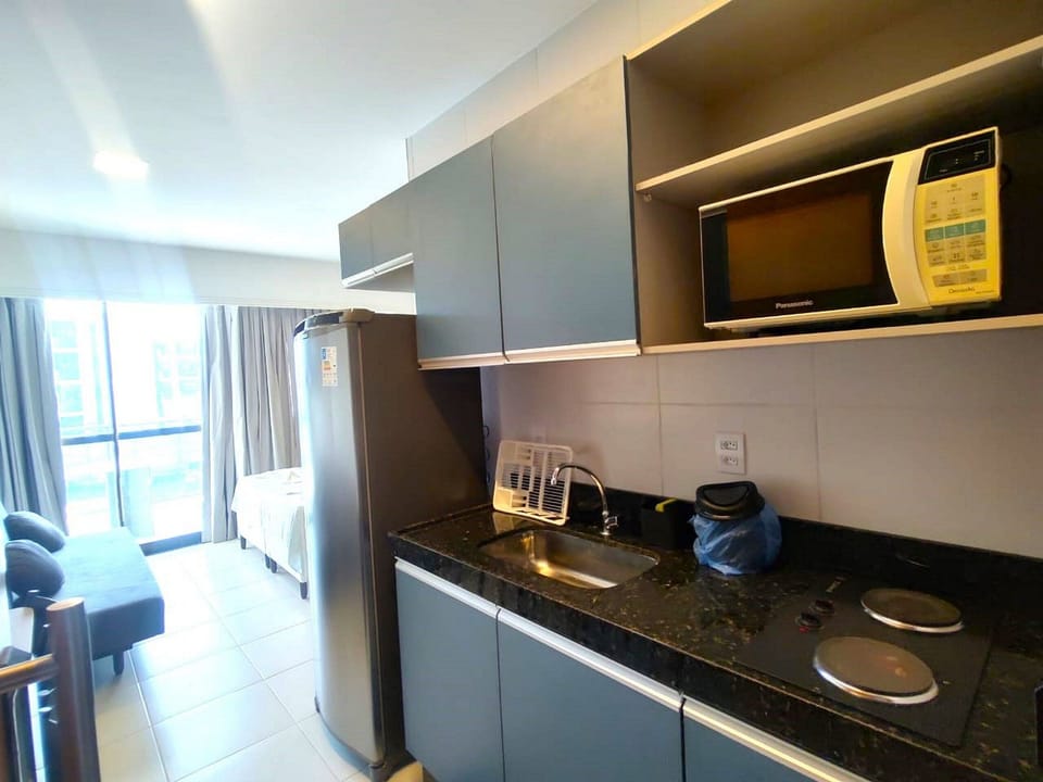Comfort Apartment | Private kitchen | Full-size fridge, cookware/dishes/utensils, dining tables