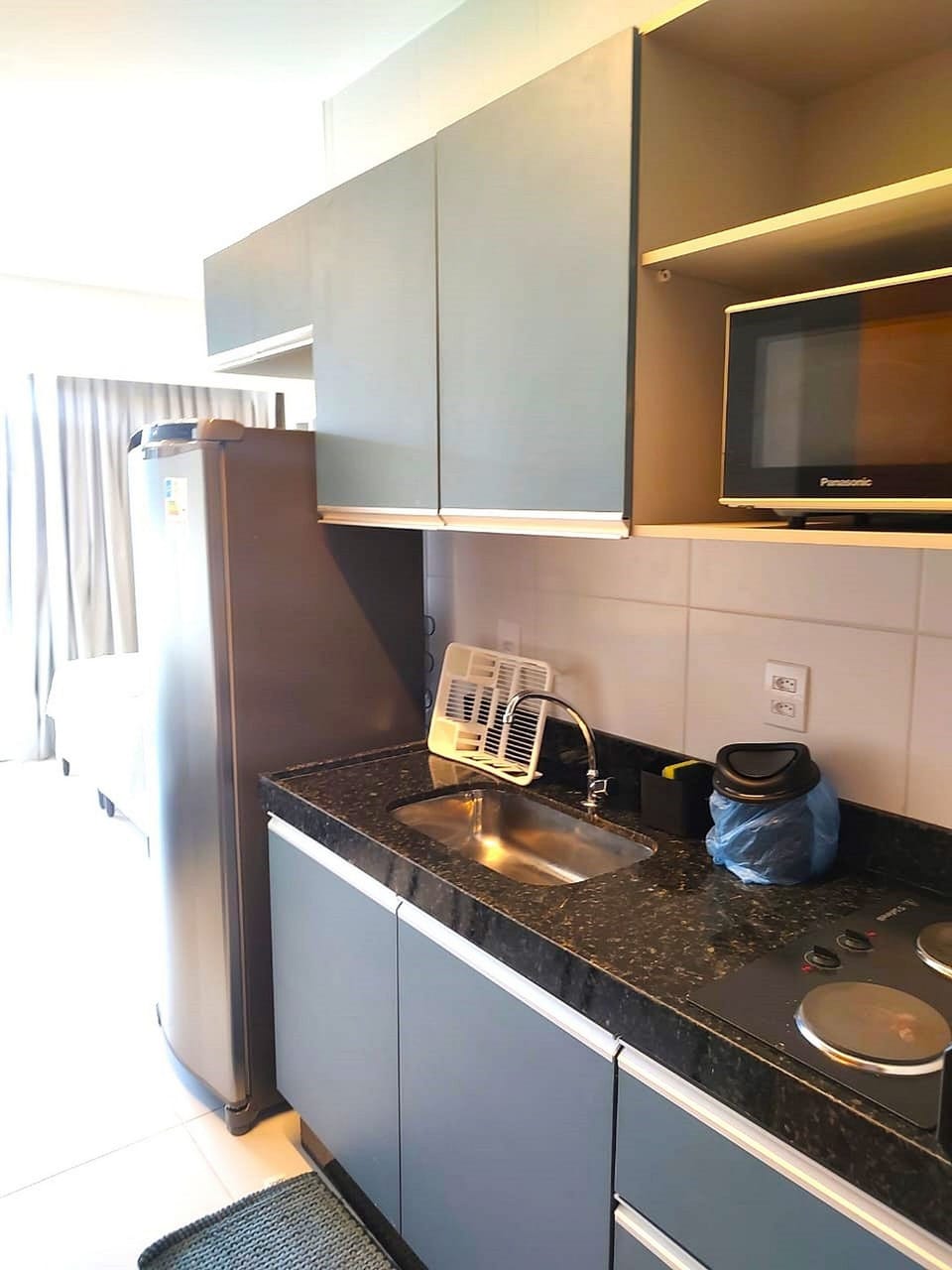 Comfort Apartment | Private kitchen | Full-size fridge, cookware/dishes/utensils, dining tables