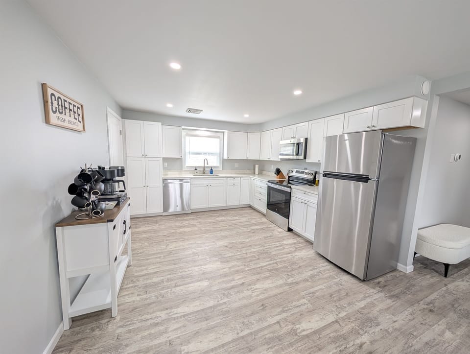 Large, open and well-stocked kitchen with tons of space.  Don't want to do dishes?  No problem - use the ultimate convenience of the dishwasher with included dish tablets.