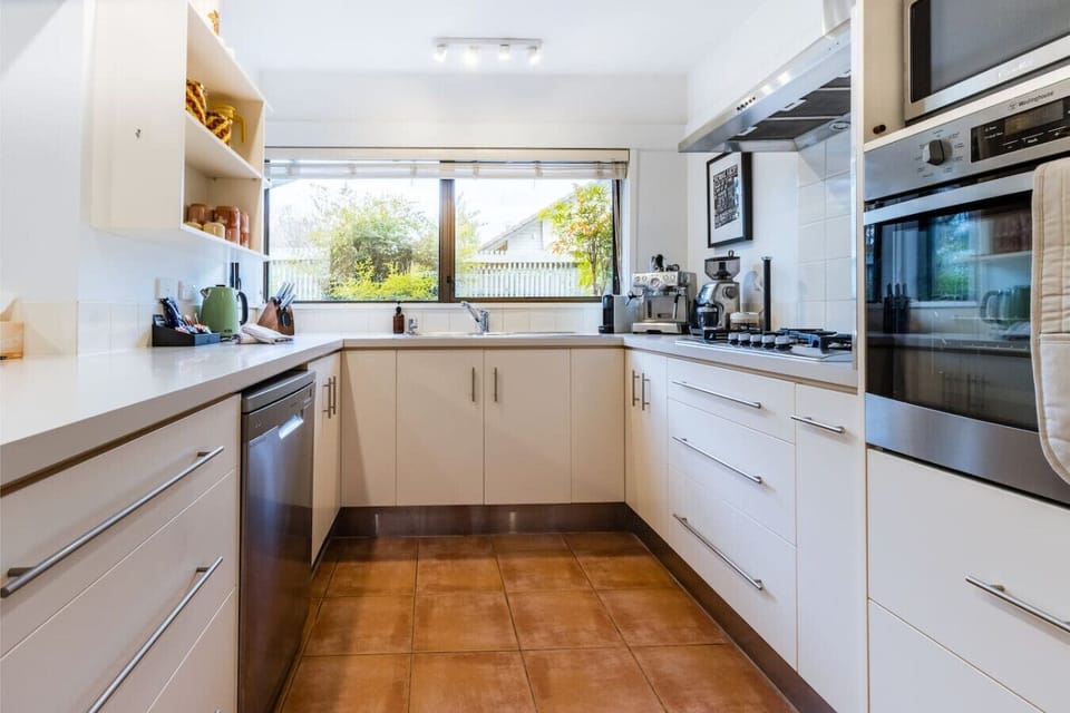 Cook up a storm in the fully loaded kitchen with modern appliances, a dishwasher, air fryer, rice cooker, sandwich press, cake stand, and all the essentials for meals big or small. It’s like your kitchen at home — but better stocked.