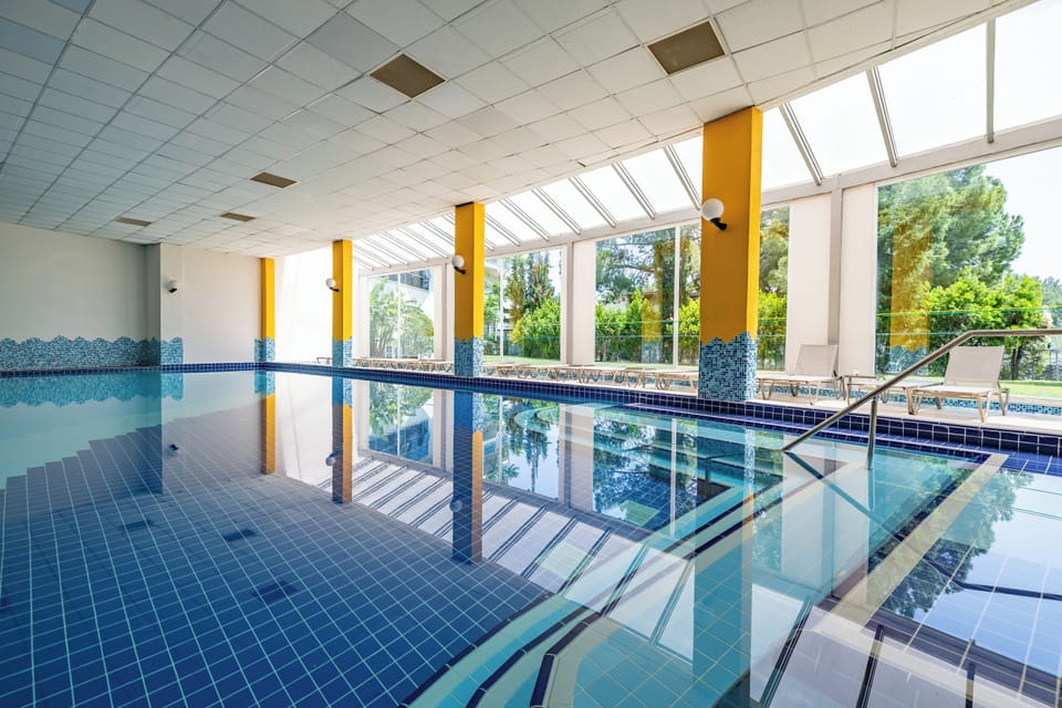 Indoor pool, seasonal outdoor pool, pool umbrellas, sun loungers