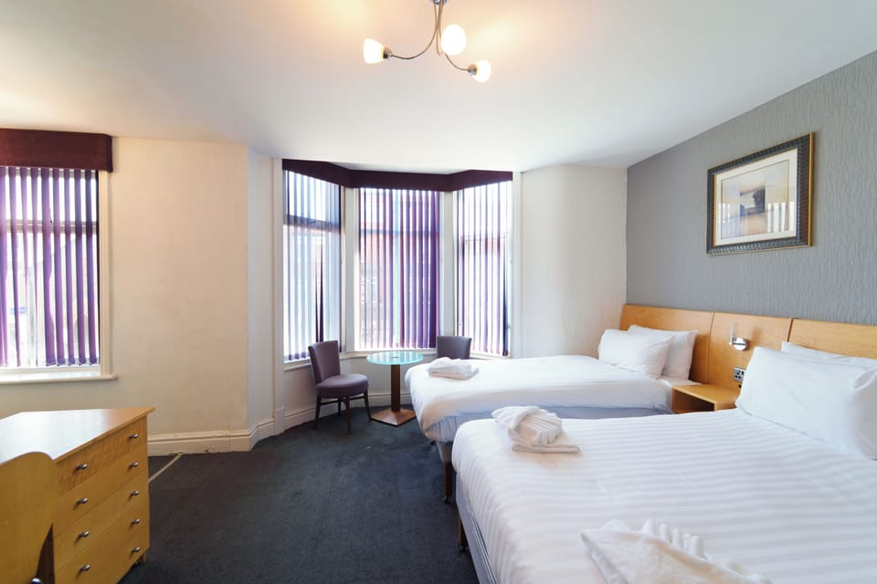 Family Quadruple Room, 1 Double bed and 2 single beds | Free cribs/infant beds, free WiFi, bed sheets