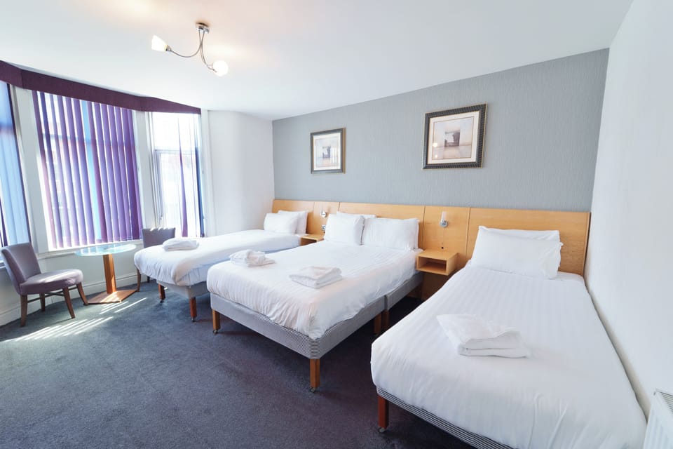 Family Quadruple Room, 1 Double bed and 2 single beds | Free cribs/infant beds, free WiFi, bed sheets