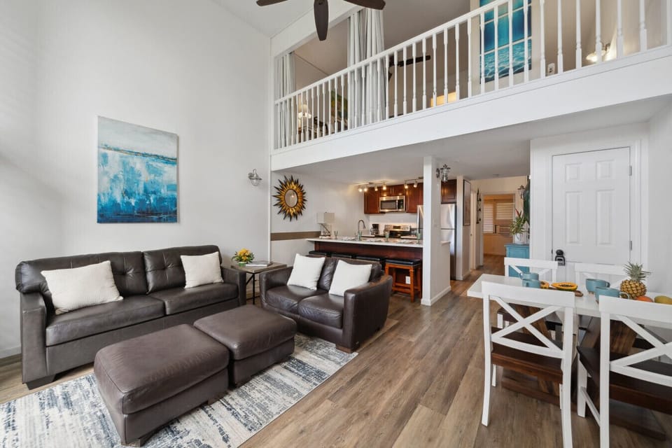 Spacious living room with high ceilings, a smart TV, and direct access to the lanai.