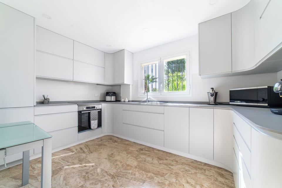 Fully equipped luxury kitchen with a full laundry room