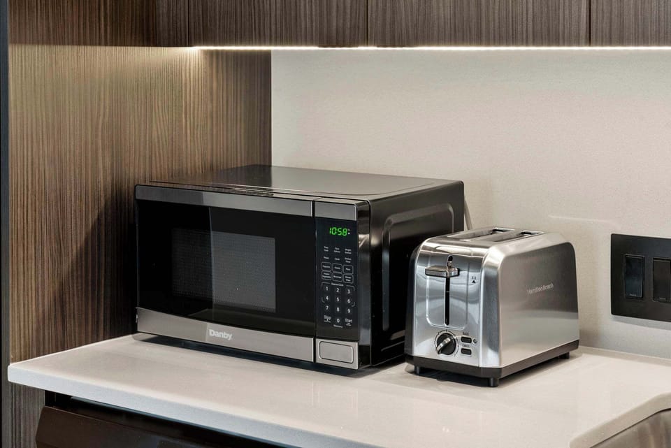 Clean-lined kitchen counters keep prep simple and the space feeling organized.