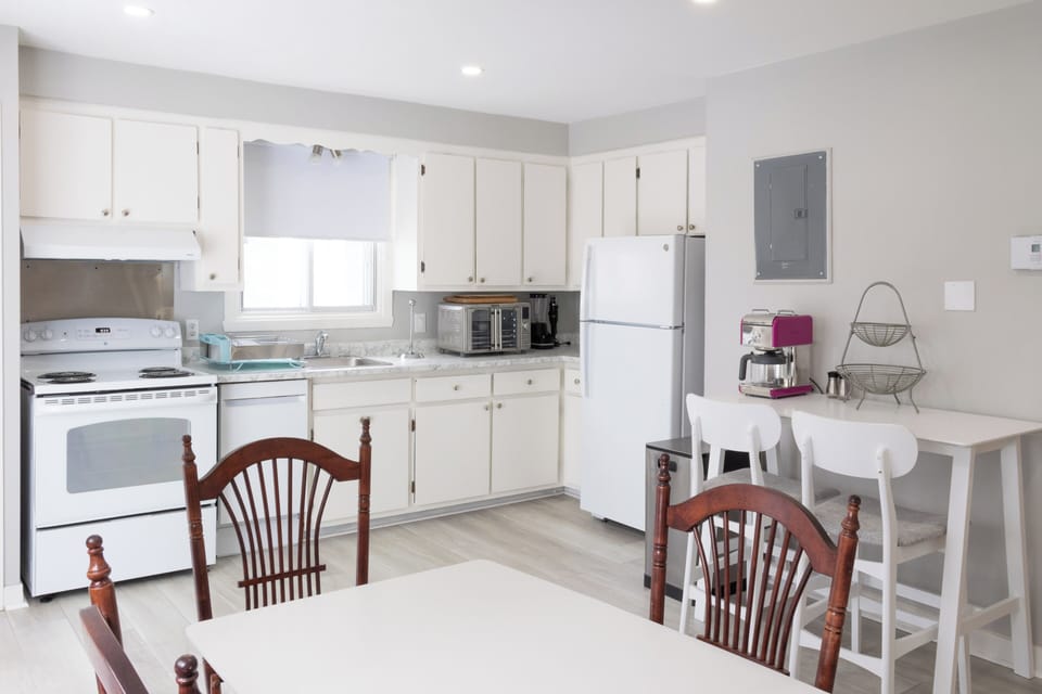 A charming kitchen, equipped for culinary adventures with modern appliances.