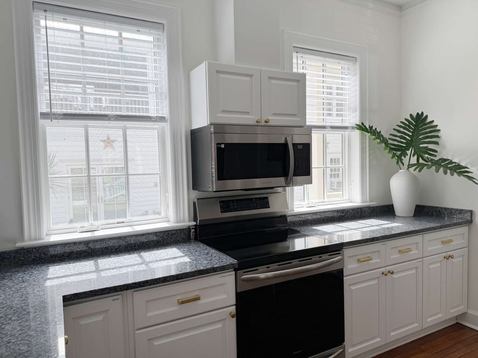 Spacious kitchen with abundant cabinets and plenty of room to store essentials. 