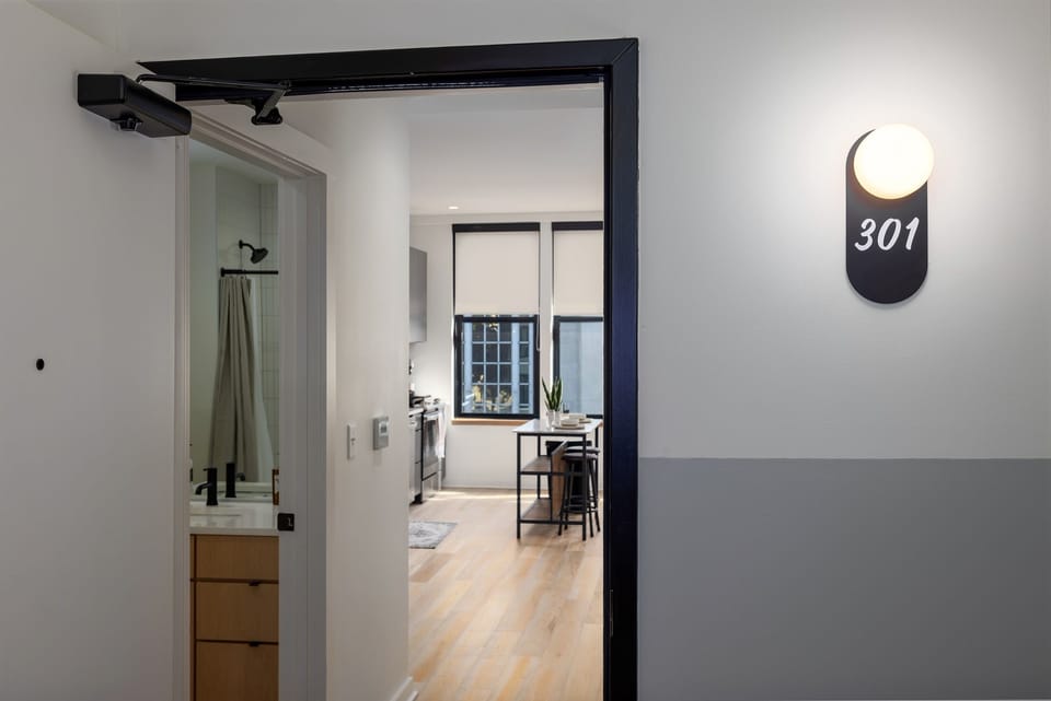 Step into luxury and charm—your private retreat on historic 2nd Avenue North, featuring a sleek modern entryway that opens up to the beautifully designed interior of this condo.