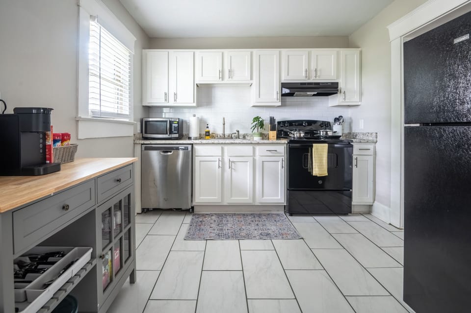 Our modern kitchen is fully equipped with updated appliances, ample counter space, and all the essentials you need for meal preparation. Whether you're whipping up a quick breakfast or creating a gourmet dinner, this kitchen offers both!