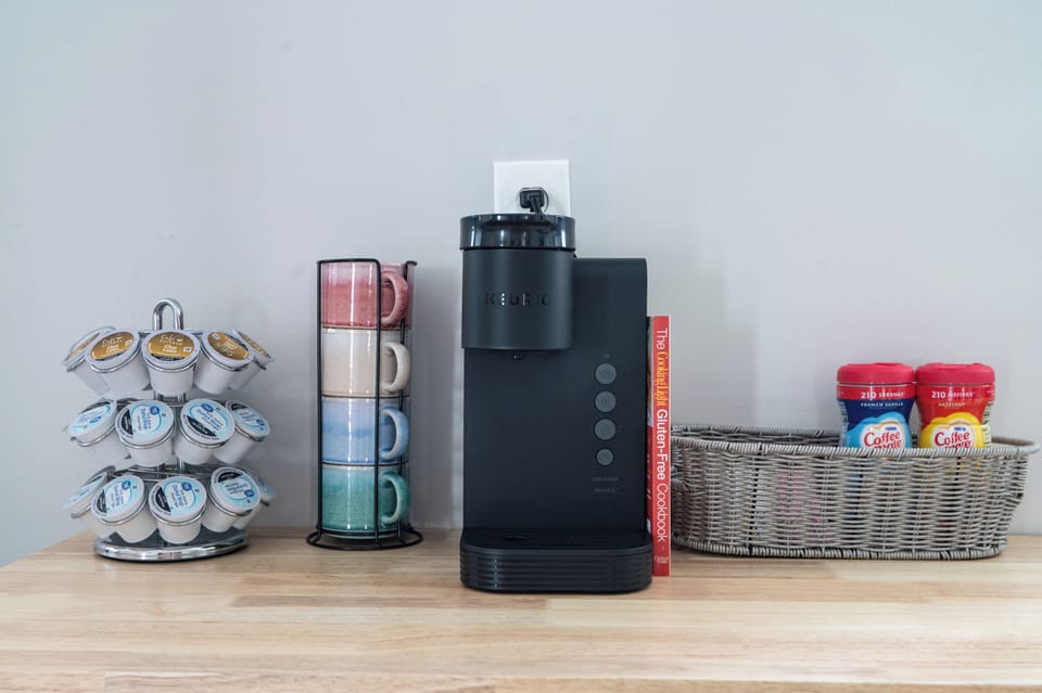 Brewing Bliss: Discover the joy of a fresh brew at our charming coffee bar. Equipped with a high-quality coffee maker, a selection of coffees, teas, and all the necessary accessories, this space is designed for coffee aficionados and casual sippers alike. 