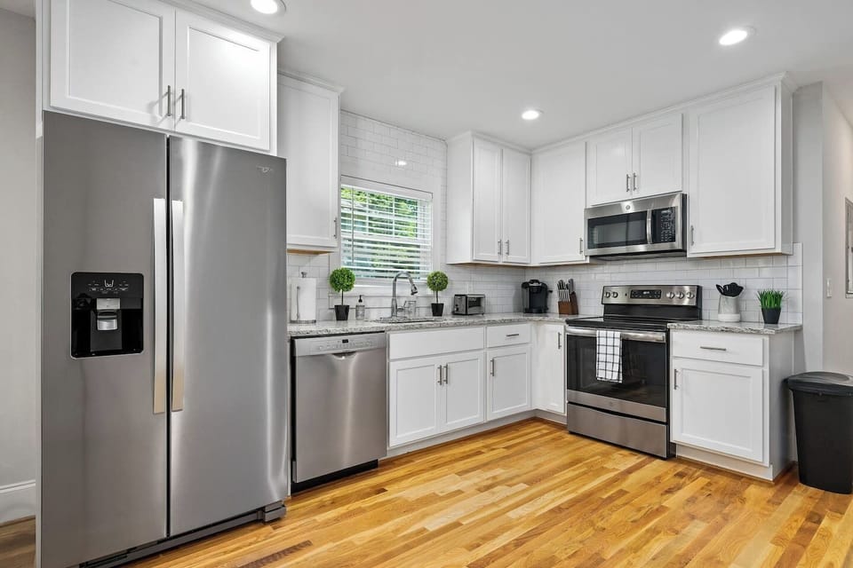 Offering a glimpse into the kitchen from the living space, highlighting the open floor plan and modern aesthetic.