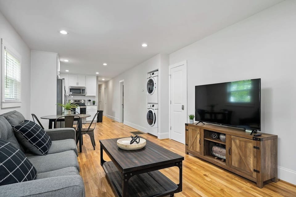 A well-appointed living area equipped with a large TV and plush seating, making it an ideal spot for movie nights.