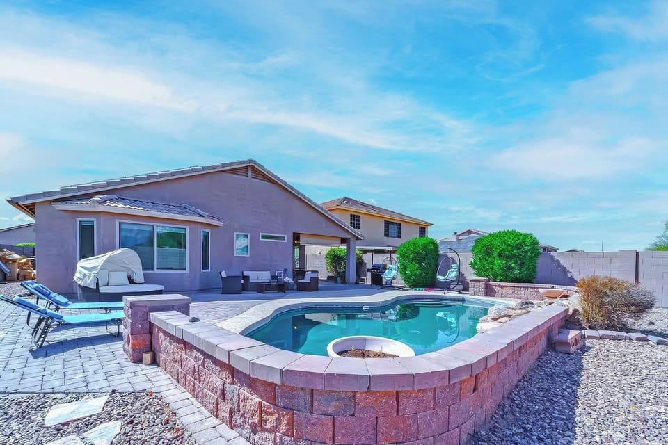 Sunny backyard oasis with private pool, loungers & covered patio