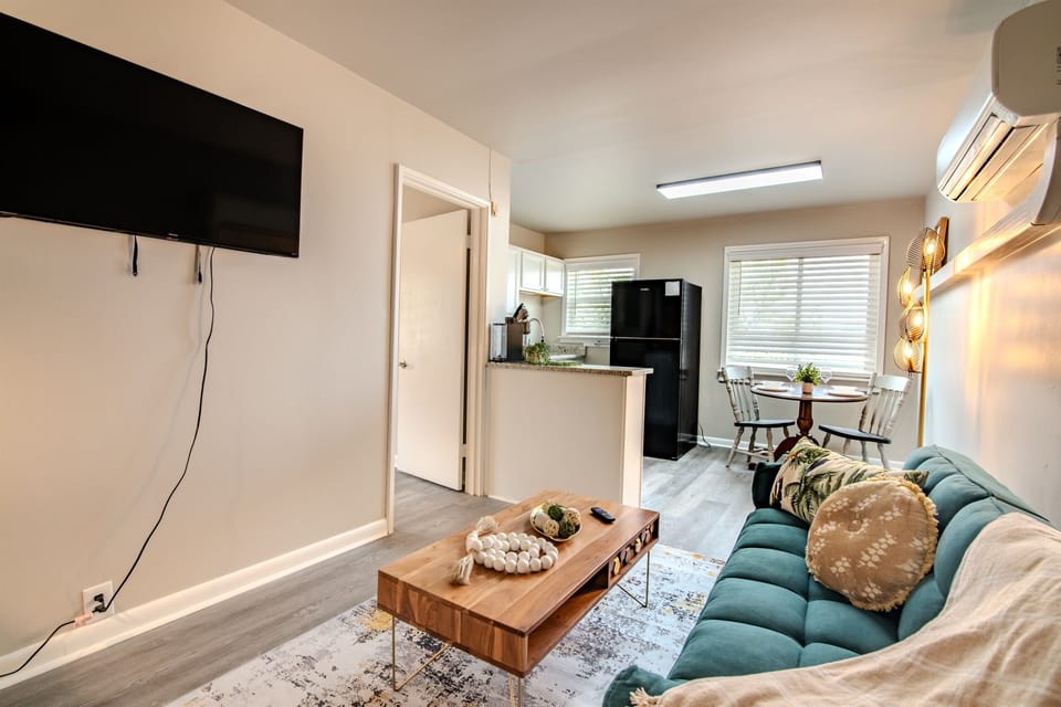 Compact living area with flat-screen TV, blending entertainment and comfort.