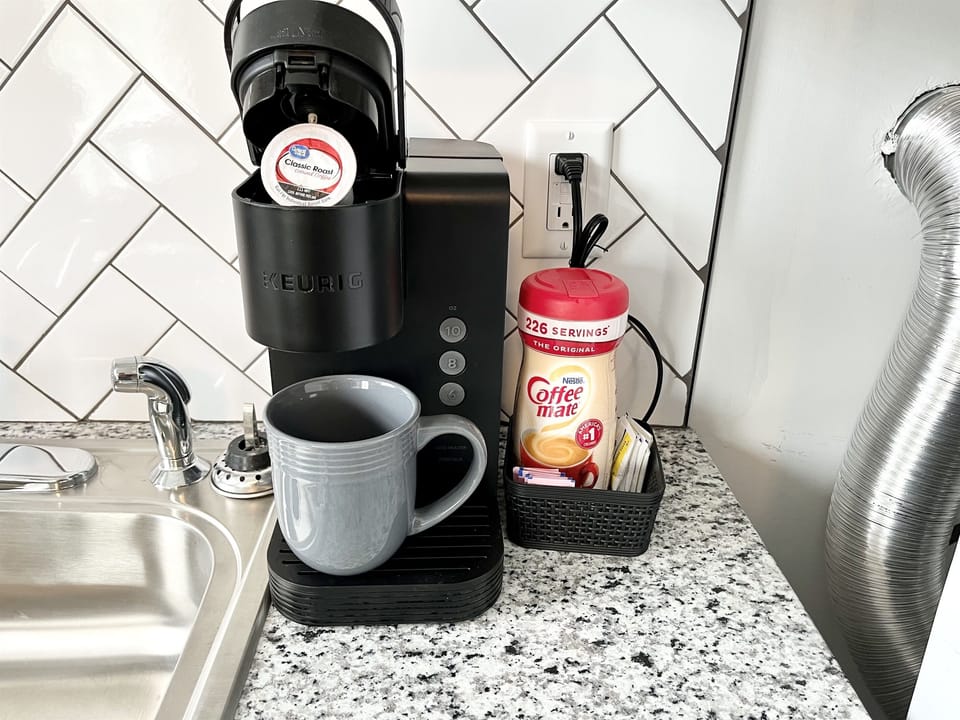 Coffee Machine, pods, and creamer