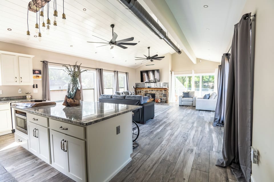 View from the hallway showcasing the open kitchen and living room concept.