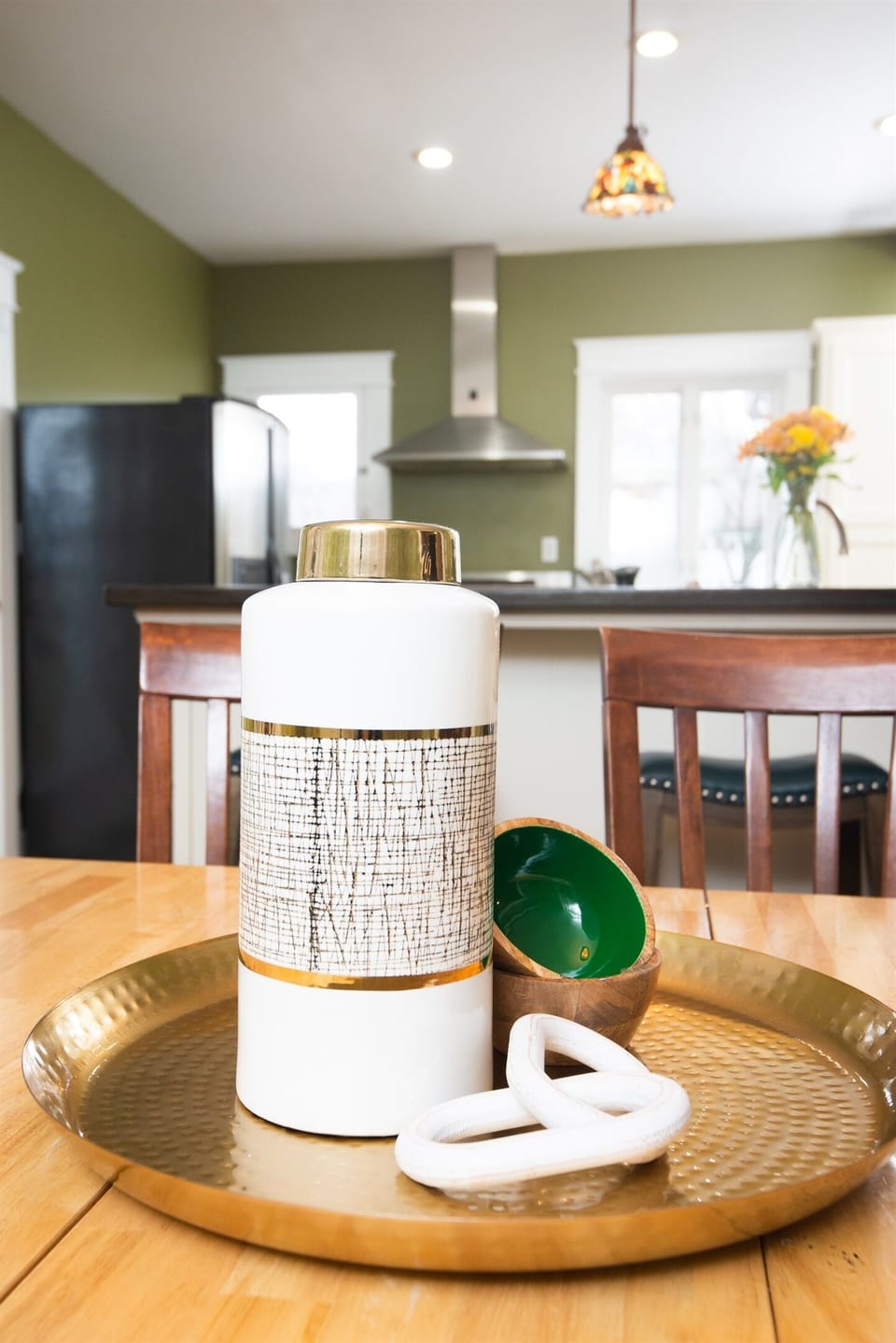 The dining area features a stylish, thoughtfully designed space with a statement table and elegant chairs. Accents like a chic light fixture or centerpiece add charm, blending comfort and sophistication for both casual meals and special gatherings.