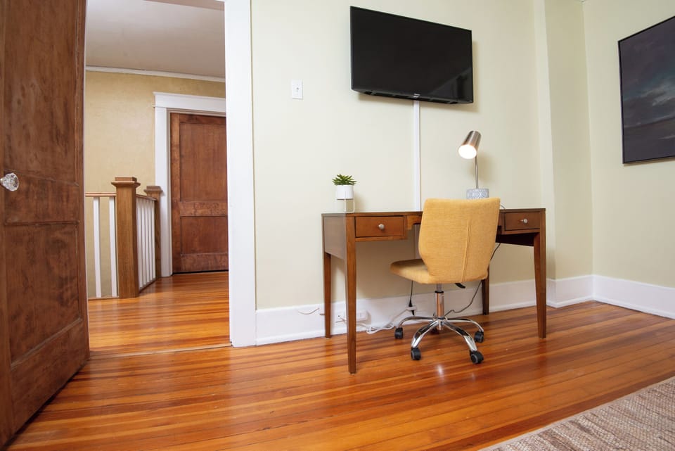 This dedicated workspace offers a quiet and comfortable area ideal for productivity. Featuring a sturdy desk, supportive chair, and good lighting, it’s perfect for remote work, studying, or catching up on emails in a peaceful environment.