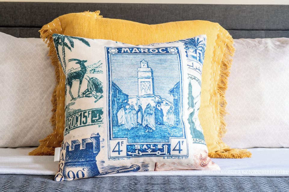 Bright blue and yellow accents add just a fun little flare to this king bedroom with en-suite bathroom