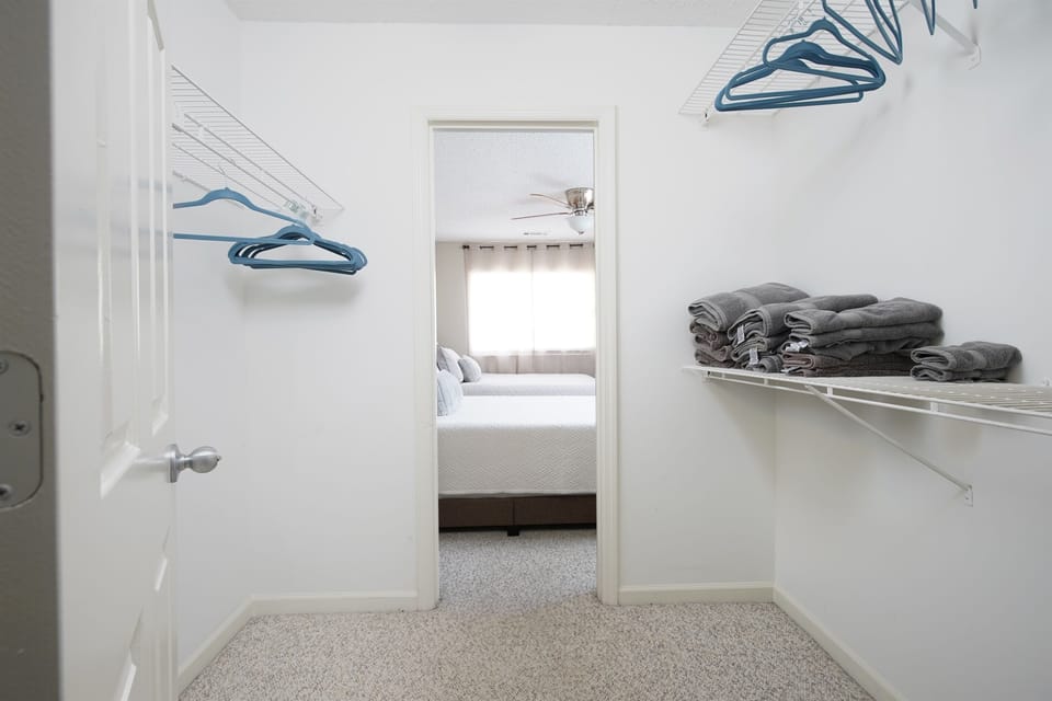 Walk-In Closet: Spacious walk-in closet with plenty of room to organize and store your belongings.