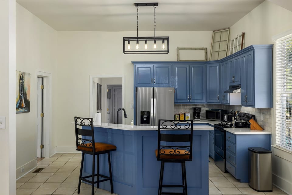 The fully equipped kitchen is a chef's delight, offering modern appliances, ample counter space, and stylish cabinetry. Whether you're preparing a quick breakfast or a gourmet dinner, you'll find everything you need to create delicious meals.