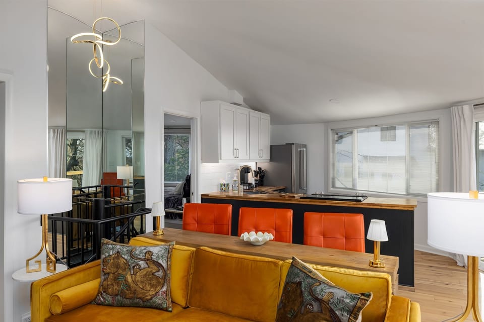 Dine in style with a view over the living room, in a space that seamlessly transitions into a well-appointed kitchen.