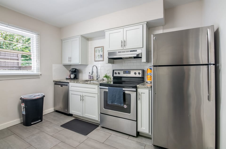 Open kitchen layout with natural light, full-size appliances, and all the basics covered.