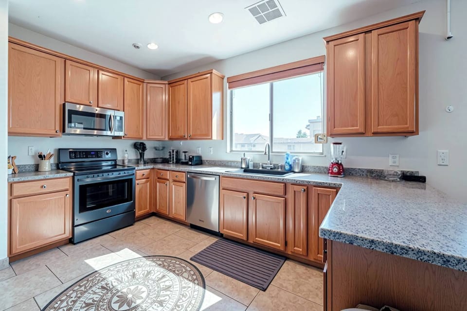 Bright kitchen with stainless appliances and generous counter space