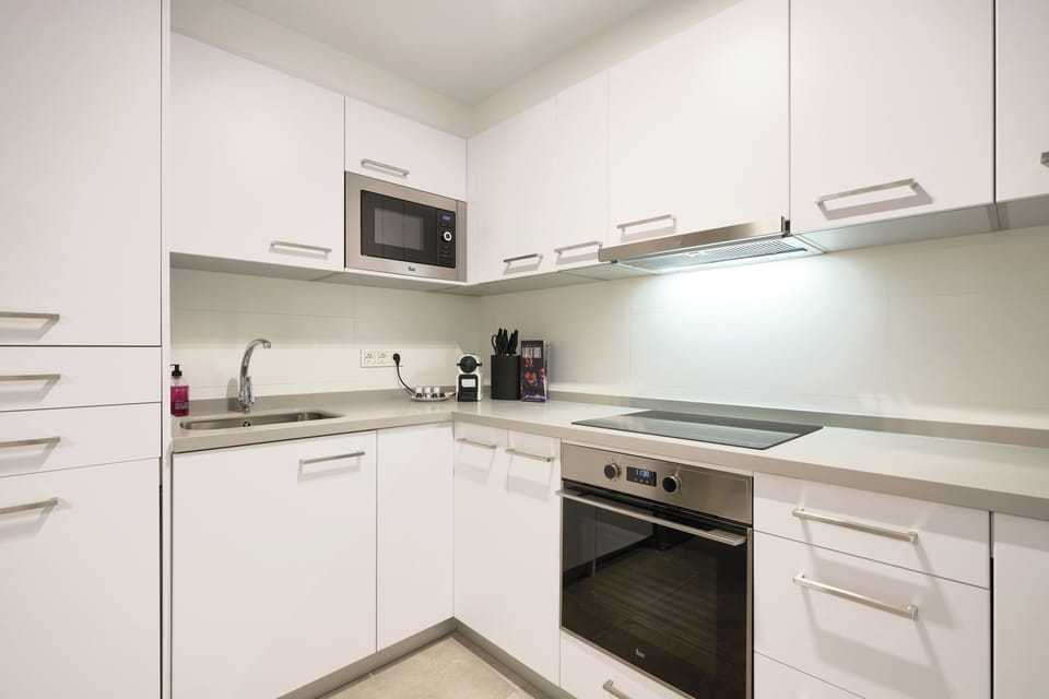 Exclusive Apartment, Kitchen, City View | Private kitchen | Full-size fridge, microwave, oven, stovetop