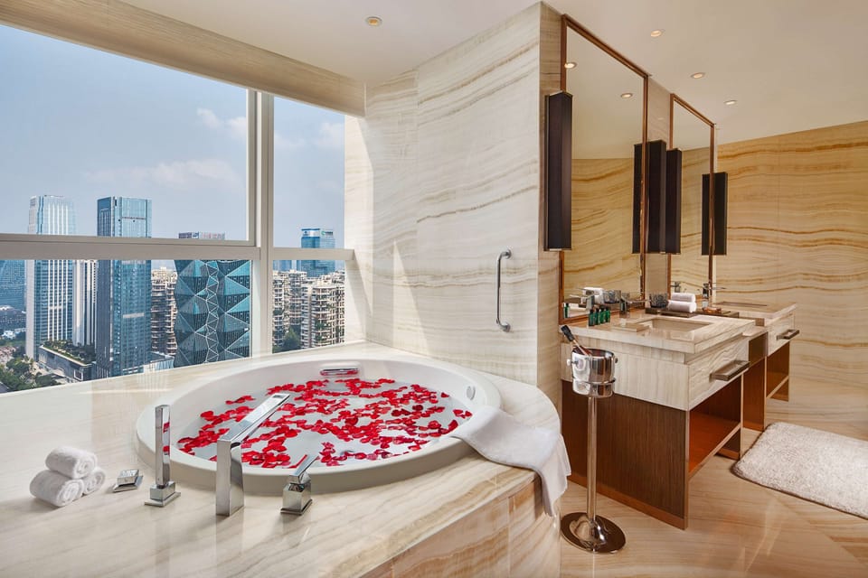 Designer toiletries, hair dryer, bathrobes, slippers
