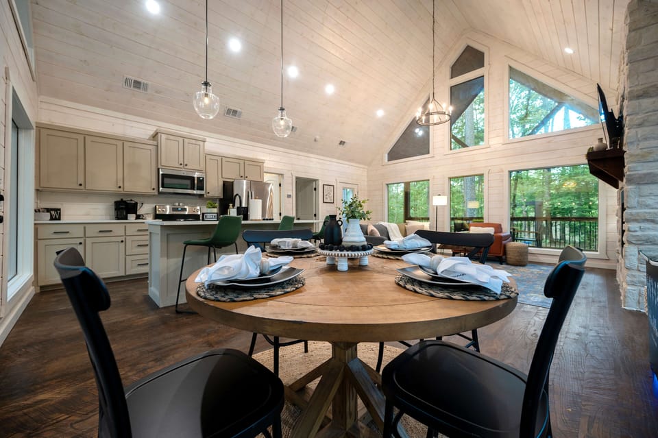 Modern open-concept kitchen and dining area with natural lighting.