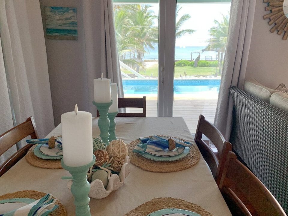View of pool and Caribbean beyond dining space