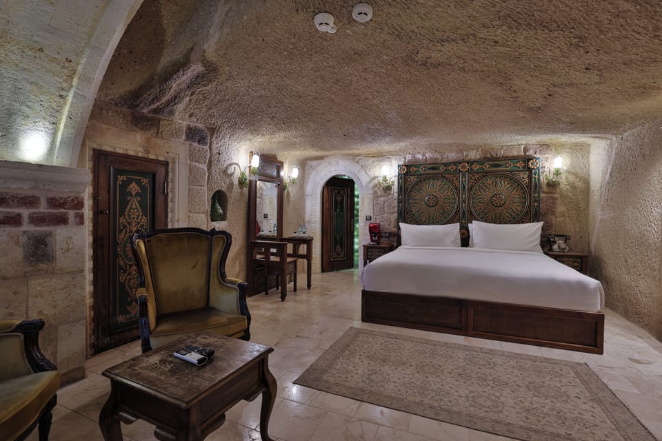King Cave Room with Whirlpool Bath | Living area | Flat-screen TV, heated floors