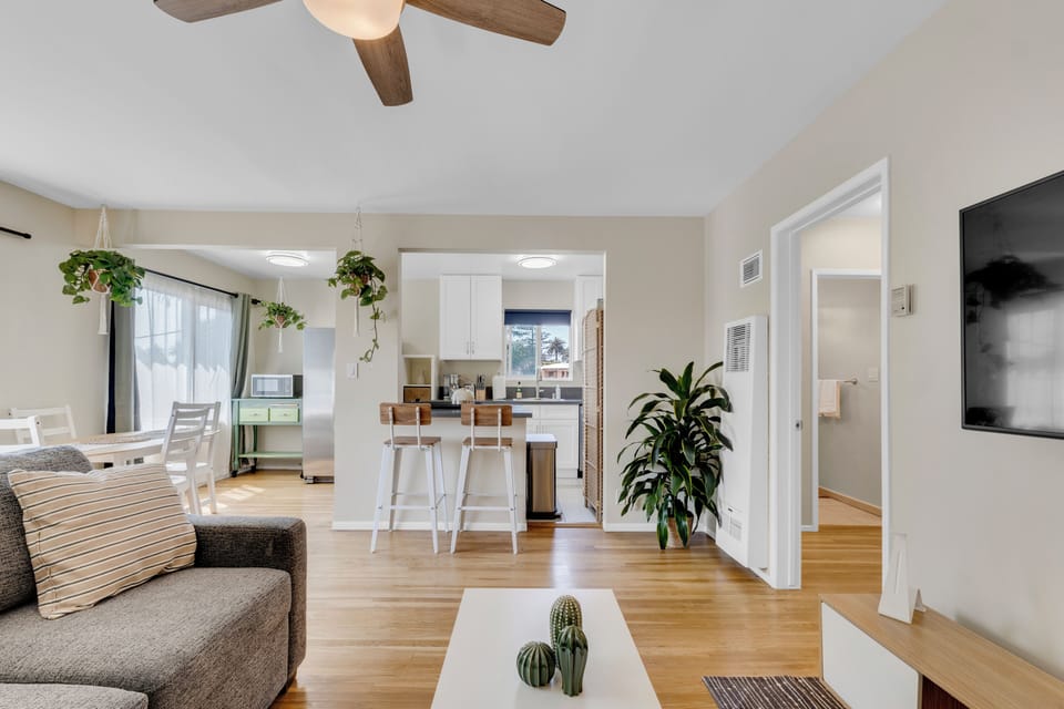 Living room includes a comfy sofa with queen pull out bed and Smart TV.