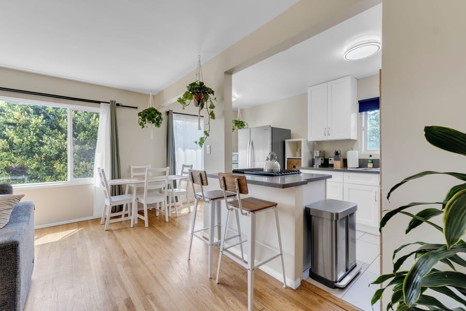 The open concept layout connects the living room, kitchen, and dining area.